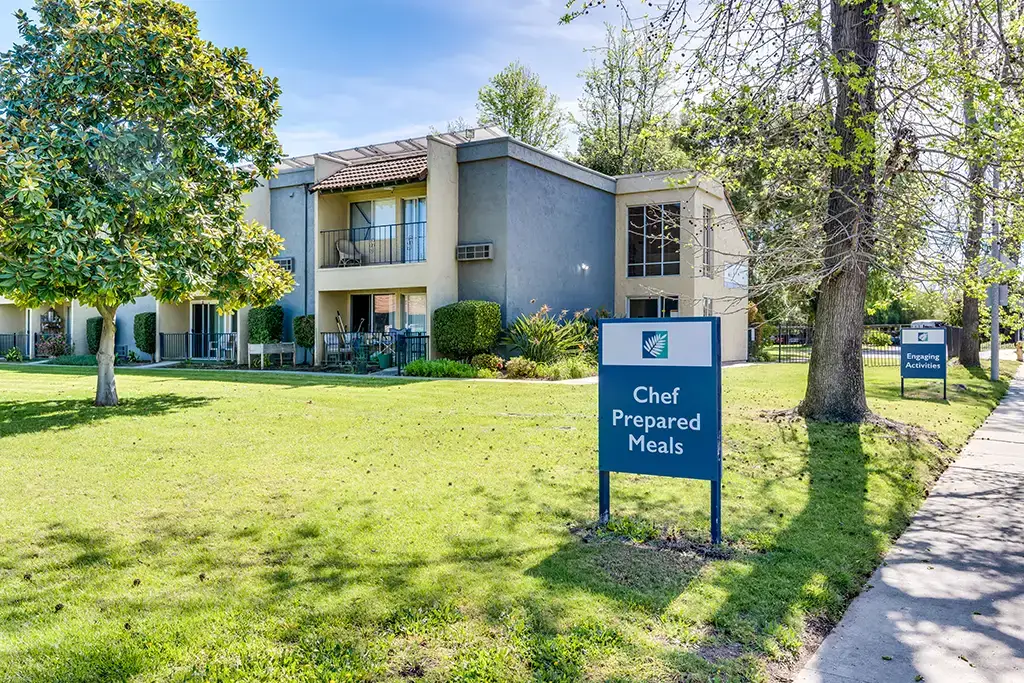 arm chairs and a couch in front of a banister